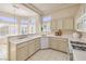 Sun-drenched kitchen featuring expansive windows, ample counter space, and modern appliances at 10057 Bundella Dr, Las Vegas, NV 89134
