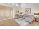 Inviting living room with high ceilings, neutral decor, and a view of the front door and entryway at 10057 Bundella Dr, Las Vegas, NV 89134