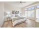 Serene main bedroom with ample natural light, a ceiling fan, and elegant decor at 10057 Bundella Dr, Las Vegas, NV 89134