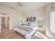 Inviting main bedroom featuring calming decor, natural light, and wood-look flooring at 10057 Bundella Dr, Las Vegas, NV 89134