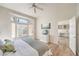 Bright main bedroom boasts a bay window, ceiling fan, and a seamless connection to the office at 10057 Bundella Dr, Las Vegas, NV 89134