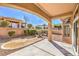 Covered patio showcasing desert landscaping with rock and bush ground cover at 10057 Bundella Dr, Las Vegas, NV 89134