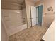 Bathroom features a bath tub with shower and a vanity with plenty of counter space at 11763 Village Arbor St, Las Vegas, NV 89183
