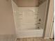 A shower and tub combination is inside this bathroom with a view of the door at 11763 Village Arbor St, Las Vegas, NV 89183