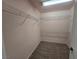 Walk-in closet complete with shelving installed and neutral carpet at 11763 Village Arbor St, Las Vegas, NV 89183