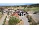 Expansive aerial view of a two-story home, manicured landscaping, and a large driveway at 18 Grand Corniche Dr, Henderson, NV 89011