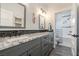 Stylish bathroom with granite counters, dual sinks and updated tile at 18 Grand Corniche Dr, Henderson, NV 89011