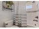 Cozy bathroom featuring a shower-tub combo with window and unique décor at 18 Grand Corniche Dr, Henderson, NV 89011