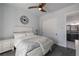Bright bedroom with connecting bath, ceiling fan, and closet at 18 Grand Corniche Dr, Henderson, NV 89011