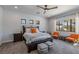 Bright bedroom featuring a large bed, stylish seating, and serene views of the outdoors at 18 Grand Corniche Dr, Henderson, NV 89011