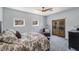 Relaxing bedroom with dual windows, plush chair, and direct balcony access at 18 Grand Corniche Dr, Henderson, NV 89011