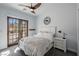 Bright bedroom with access to balcony, ceiling fan, and simple décor at 18 Grand Corniche Dr, Henderson, NV 89011