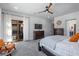 Comfortable bedroom with a sliding glass door to the patio, ceiling fan, and neutral color palette at 18 Grand Corniche Dr, Henderson, NV 89011