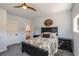 Comfortable bedroom with ceiling fan, carpet and natural light throughout at 18 Grand Corniche Dr, Henderson, NV 89011