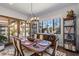 Charming dining area with seating for six, stylish lighting, and a view to the outdoor space at 18 Grand Corniche Dr, Henderson, NV 89011