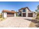 Stunning three-car garage home featuring a paver driveway at 18 Grand Corniche Dr, Henderson, NV 89011