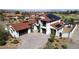 Two-story home boasts red tile roof, three-car garage, and a beautiful front yard at 18 Grand Corniche Dr, Henderson, NV 89011