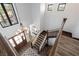 Stunning foyer with staircase, wood-look tile flooring, large windows, chandelier and natural light at 18 Grand Corniche Dr, Henderson, NV 89011