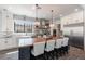 Beautiful kitchen with a large island, stainless steel appliances, and stylish pendant lights at 18 Grand Corniche Dr, Henderson, NV 89011