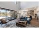 Living room overlooking the backyard pool area and open kitchen at 18 Grand Corniche Dr, Henderson, NV 89011