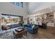Open-concept living room with seamless transition to the outdoor pool and kitchen at 18 Grand Corniche Dr, Henderson, NV 89011