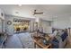 Open-concept living room with cozy seating and access to outdoor patio with beautiful views at 18 Grand Corniche Dr, Henderson, NV 89011