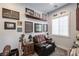 Comfortable living room with natural light, sports memorabilia, and comfortable chair at 18 Grand Corniche Dr, Henderson, NV 89011