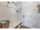 Inviting mud room with a bench, hooks, and storage baskets for an organized entry at 18 Grand Corniche Dr, Henderson, NV 89011