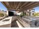 State-of-the-art outdoor kitchen with stainless steel appliances, a built-in grill and custom countertops at 18 Grand Corniche Dr, Henderson, NV 89011