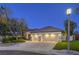 Inviting home featuring a well-manicured front yard and a spacious three-car garage at 1900 Vero Dr, Las Vegas, NV 89134
