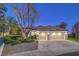 Charming home featuring a well-manicured front yard and a spacious three-car garage at 1900 Vero Dr, Las Vegas, NV 89134