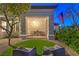Cozy front porch with outdoor seating, a charming table, and a well-maintained lawn at 1900 Vero Dr, Las Vegas, NV 89134