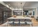 Contemporary kitchen with large island, seating, and an open layout that flows into the living area at 1900 Vero Dr, Las Vegas, NV 89134