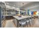Bright kitchen features a large island with seating, modern appliances, and flows into the living area at 1900 Vero Dr, Las Vegas, NV 89134