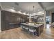 Spacious kitchen features a large island with seating, modern appliances, and stylish backsplash at 1900 Vero Dr, Las Vegas, NV 89134
