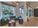 Cozy living room with large windows, stylish furnishings, and a view of the outdoor area at 1900 Vero Dr, Las Vegas, NV 89134