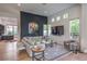 Stylish living room boasts a large sectional sofa, accent wall, and natural light at 1900 Vero Dr, Las Vegas, NV 89134