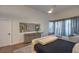 Well-lit main bedroom features a large window and simple decor at 1900 Vero Dr, Las Vegas, NV 89134