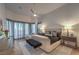 Comfortable main bedroom featuring neutral tones, a ceiling fan and soft lighting at 1900 Vero Dr, Las Vegas, NV 89134