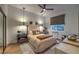 Comfortable main bedroom featuring ambient lighting, plush bedding, and stylish furnishings at 1900 Vero Dr, Las Vegas, NV 89134
