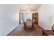Traditional dining room with carpet, a wooden table set, and a decorative hutch at 2086 Angel Falls Dr, Henderson, NV 89074