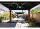 Backyard spa, covered seating, and waterfall feature create a relaxing outdoor escape at 2279 Pacini Ct, Henderson, NV 89052
