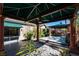 Luxurious backyard with covered seating area, jacuzzi, and a seamless indoor-outdoor living at 2279 Pacini Ct, Henderson, NV 89052