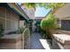 Charming home featuring mature landscaping and a welcoming entrance with gated courtyard, and tile roof at 2279 Pacini Ct, Henderson, NV 89052