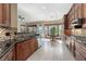 Gourmet kitchen boasting granite countertops, stainless steel appliances, tile backsplash, and custom cabinetry at 2279 Pacini Ct, Henderson, NV 89052