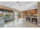 Bright open living area with tile floors, large windows and access to outdoor patio at 2279 Pacini Ct, Henderson, NV 89052