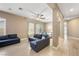 Spacious living room with plush seating, ample natural light, and an open layout, perfect for relaxing and entertaining at 2279 Pacini Ct, Henderson, NV 89052