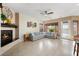 Bright open living area with tile floors, fireplace, and access to the outdoor patio at 2279 Pacini Ct, Henderson, NV 89052