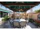 Inviting outdoor seating area featuring a built-in bar, perfect for entertaining guests in style at 2279 Pacini Ct, Henderson, NV 89052