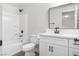 Modern bathroom featuring a shower-tub combo with a new vanity and brushed nickel fixtures at 2729 Flower Ave, North Las Vegas, NV 89030